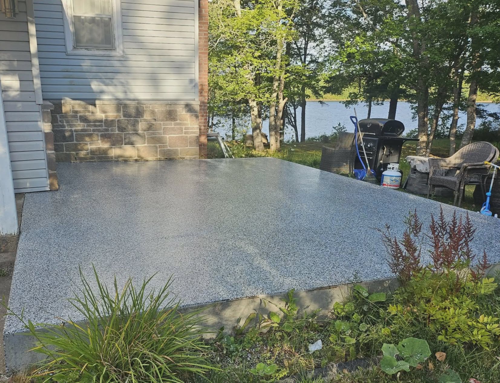 Lakeside patio with grey epoxy coating