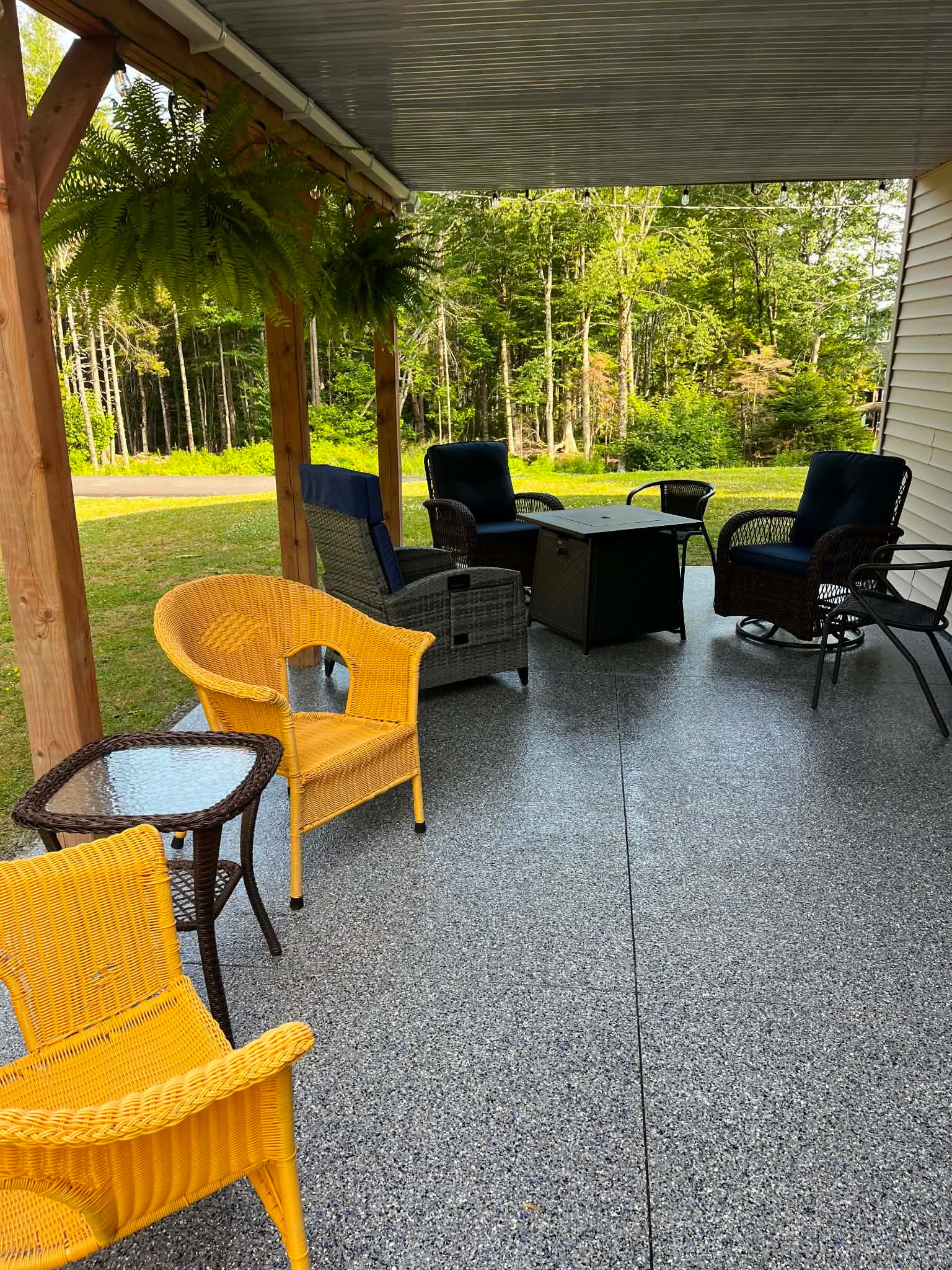 Dark flake epoxy patio with outdoor furniture
