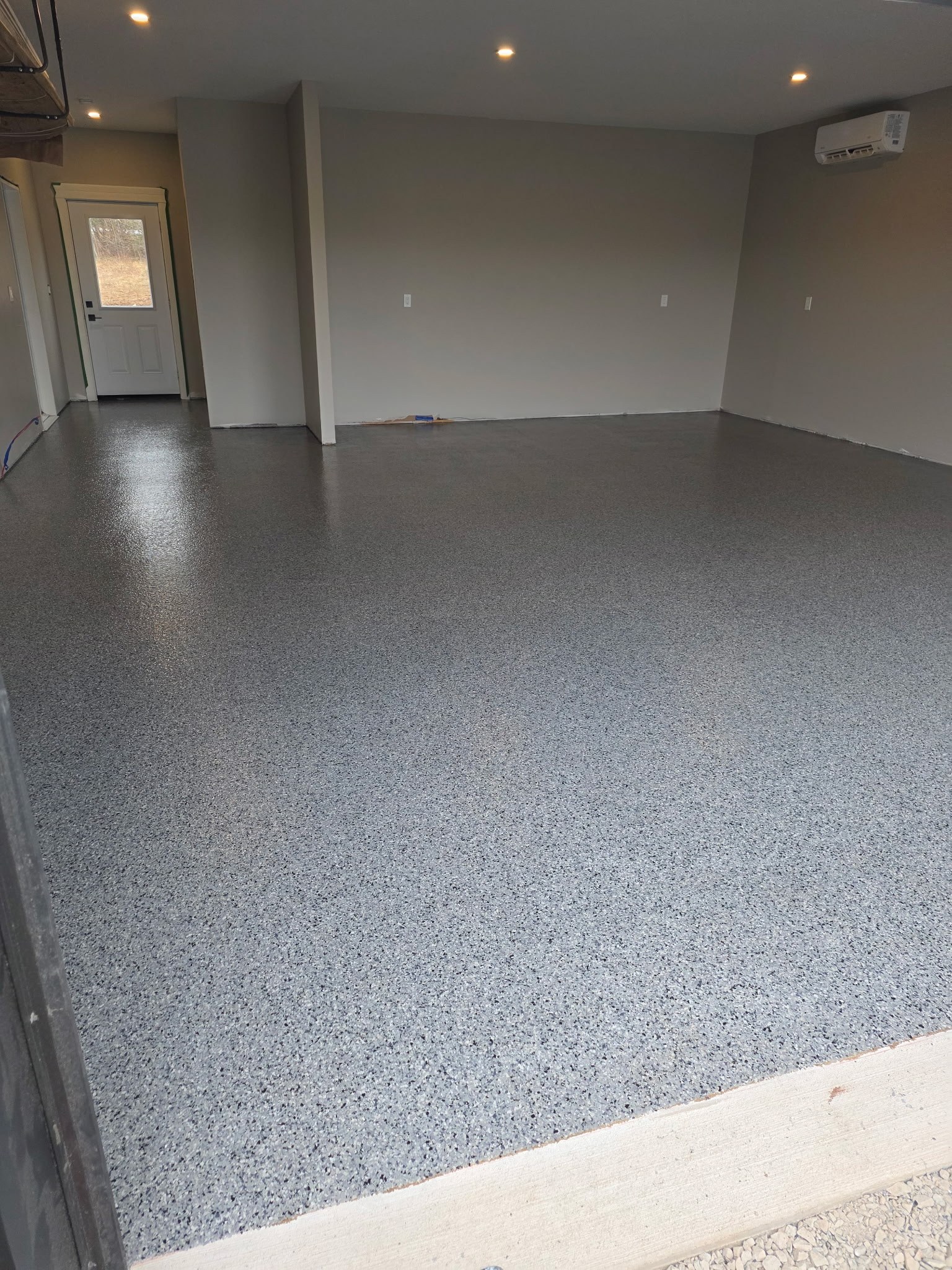 Warm grey epoxy flake large garage